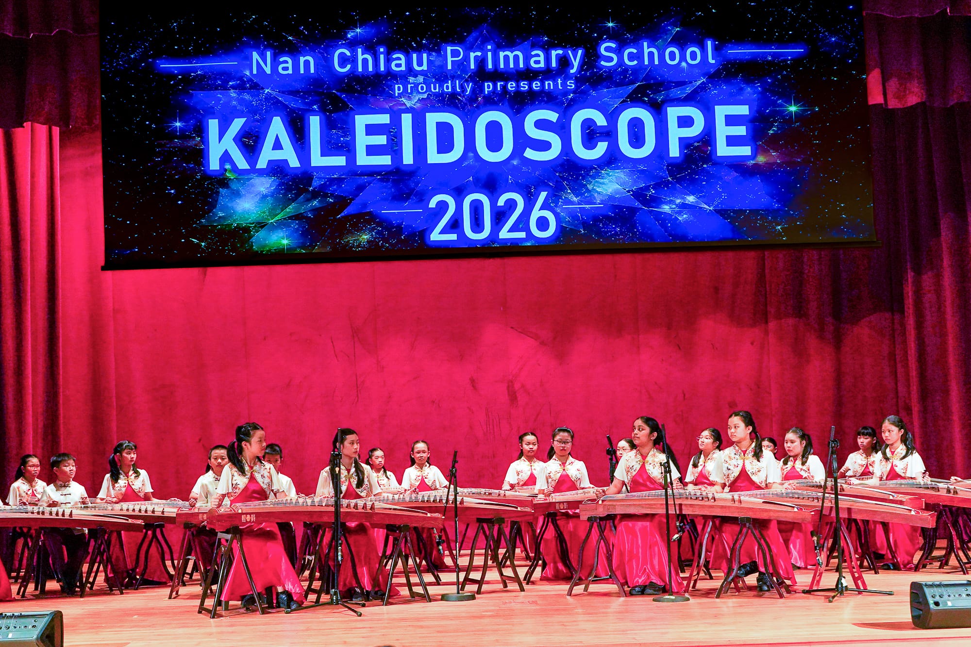 students performing on stage